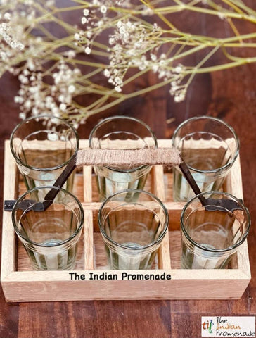 Cutting chai glasses with rustic wooden stand