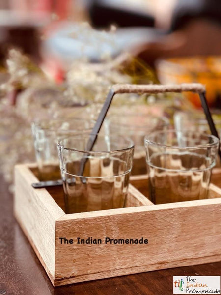Cutting chai glasses with rustic wooden stand
