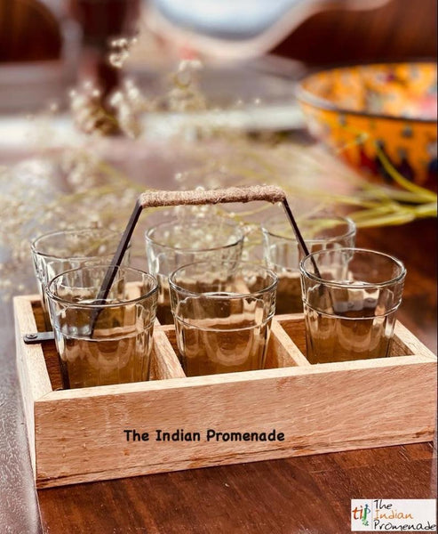 Cutting chai glasses with rustic wooden stand