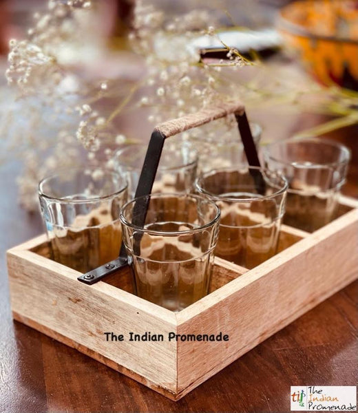 Cutting chai glasses with rustic wooden stand
